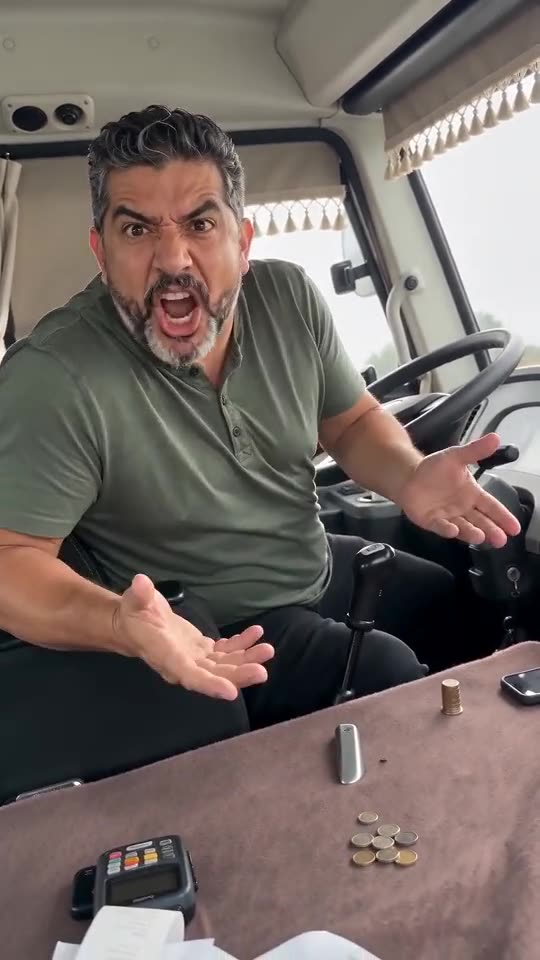 Example frame: a bearded man in a green polo turned round in a minibus driver's seat, mouth open, both hands thrown up
